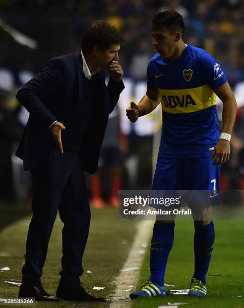 Gustavo Barros Schelotto coach of Boca Juniors talks to his player Cristiano David Pavon during a second leg match between Boca Juniors and Cerro...