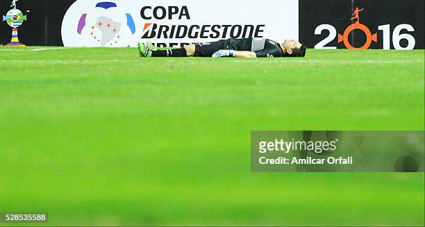 Agustin Orion goalkeeper of Boca Juniors is knocked out during a second leg match between Boca Juniors and Cerro Porteno as part of round of sixteen...