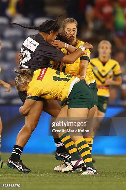 Annetta Nuuausala of the Kiwi Ferns is tackled by Ruan Sims of the Jillaroos during the Women's international Rugby League Test match between the...