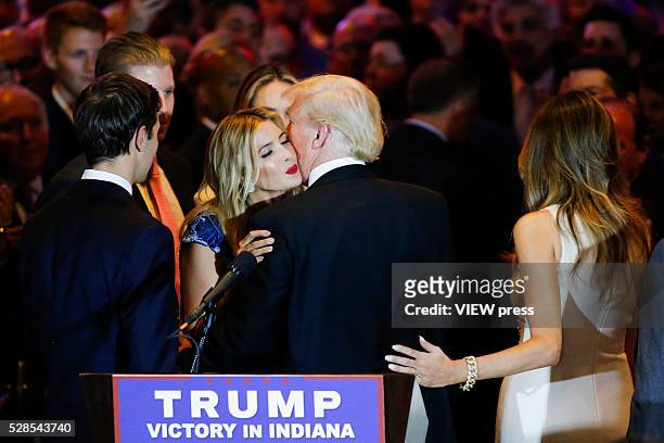 Ivanka Trump kisses her father Republican presidential front runner Donald Trump after he spoke to supporters and the media at Trump Tower in...