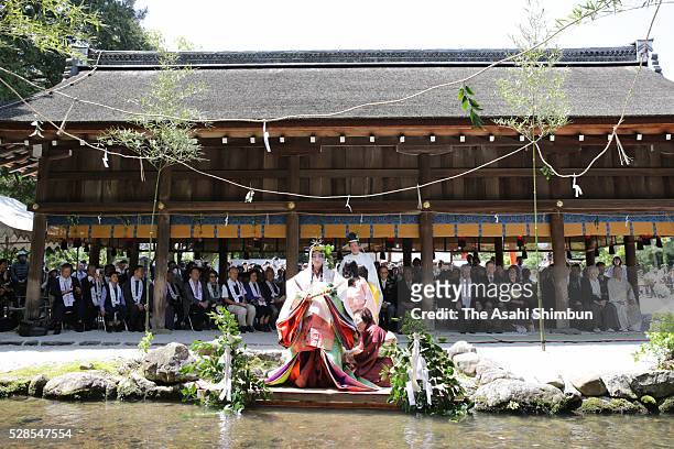 Waka Nishimura, wearing a 12-layered ceremonial kimono called 'Junihitoe', performs the 'Misogi-no-Gi ' at Kamigamo Jinja Shrine ahead of Aoi Matsuri...
