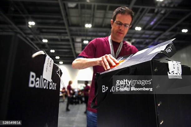 Volunteer opens a ballot box during counting for the London Mayoral election at the Excel centre in London, U.K., on Friday, May 6, 2016. Sadiq Khan,...