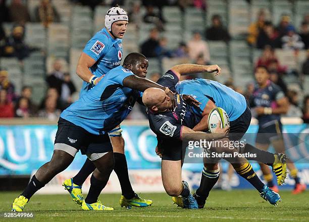 Stephen Moore of the Brumbies off loads the ball during the round 11 Super Rugby match between the Brumbies and the Bulls at GIO Stadium on May 6,...