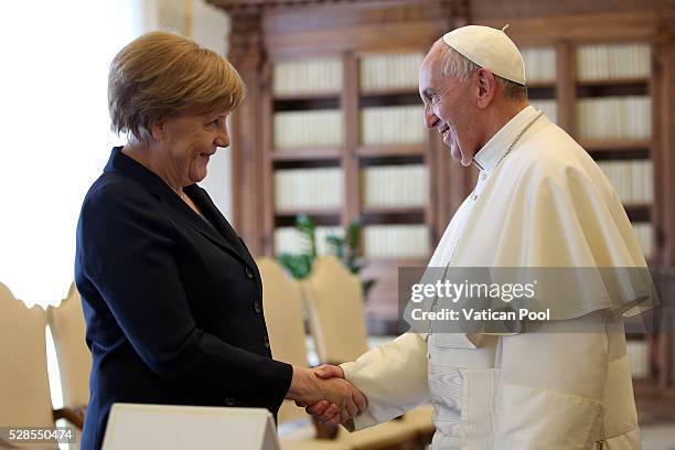 Pope Francis meets German Chancellor Angela Merkel at his private library in the Apostolic Palace on May 6, 2016 in Vatican City, Vatican. Today the...