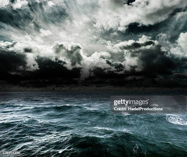 approaching storm over the ocean. - grovkornig bildbanksfoton och bilder