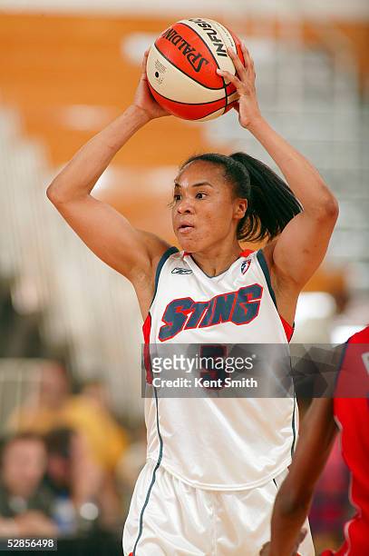 Dawn Staley of the Charlotte Sting looks for the pass against the Houston Comets on May 16, 2005 at the Bobcats Basketball Center in Fort Mill, South...