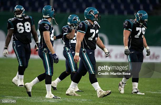 Thomas Herrion, Todd France, Zack Abron, Shawn Lynch, Rodney Reed of Hamburg are dejected during the NFL Europe match between Hamburg Sea Devils and...