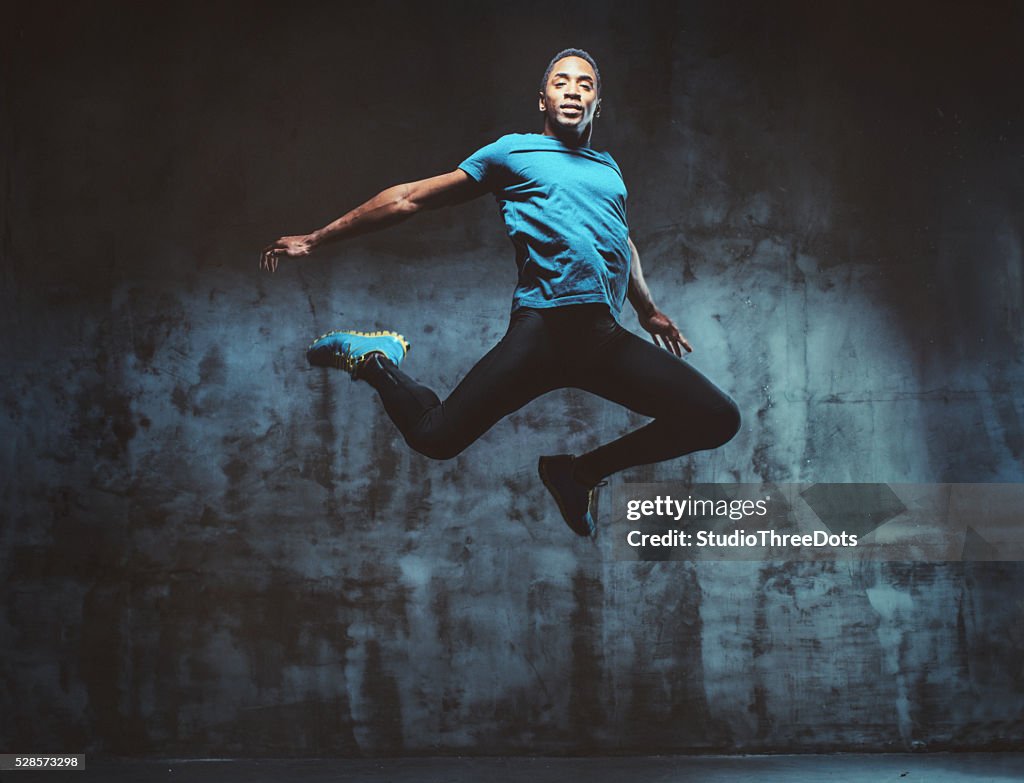 Young muscular man jumping