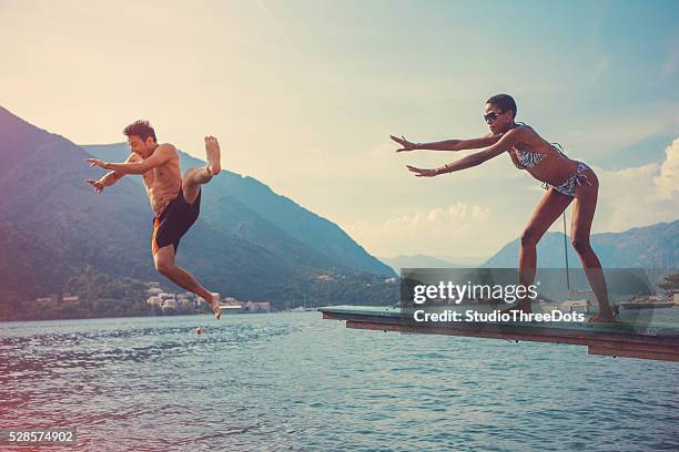 pushing boyfriend - tripping falling stock pictures, royalty-free photos & images