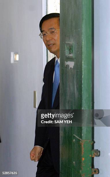 Taiwanese President Chen Shui-bian walks out of a prison cell used to hold political prisoners during a visit to the Green Island in eastern Taiwan...