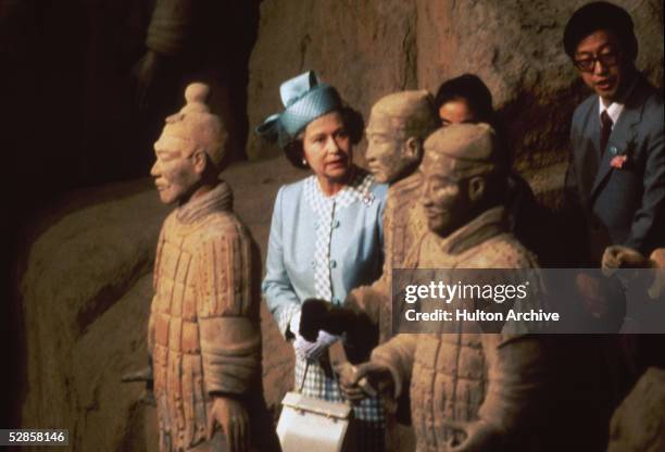 Queen Elizabeth II viewing some of the Terracotta Army soldier statues at the Mausoleum of the First Qin Emperor in the Lintong District, Xi'an,...