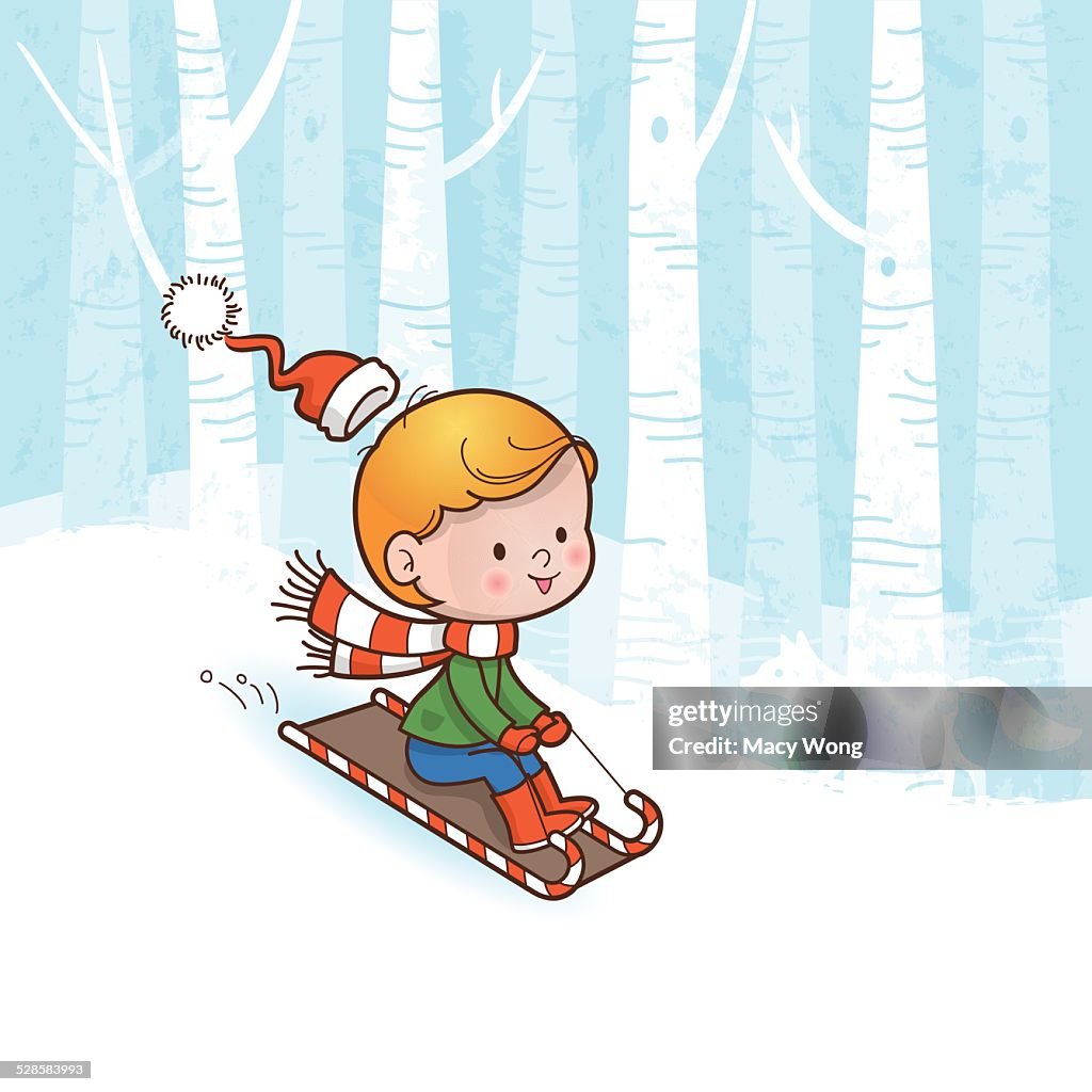 Christmas tobogganing boy