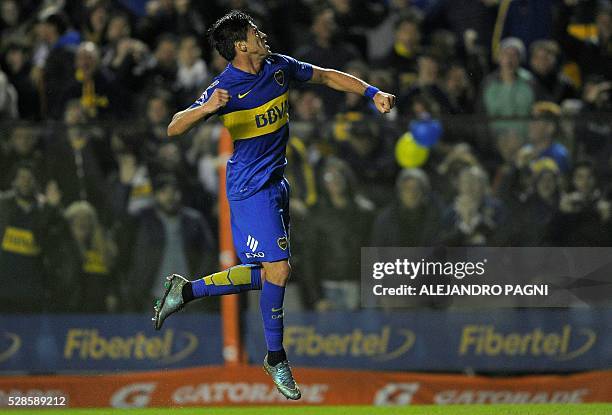 Argentina's Boca Juniors midfielder Pablo Perez celebrates after scoring the team's third goal against Paraguay's Cerro Porteno during their Copa...