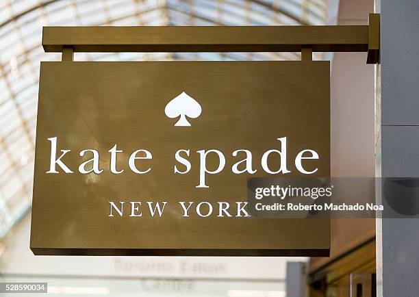 Kate Spade New York Sign in shopping mall. The retailer is known for their bold and stylish designer clothing, designer shoes, women fashion...