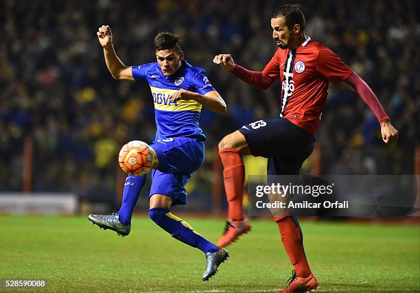 Jonathan Silva of Boca Juniors and Victor Mareco of Cerro fight for the ball during a second leg match between Boca Juniors and Cerro Porteno as part...