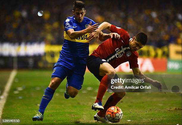 Cristian Pavon of Boca Juniors and Rodrigo Rojas of Cerro during a second leg match between Boca Juniors and Cerro Porteno as part of round of...