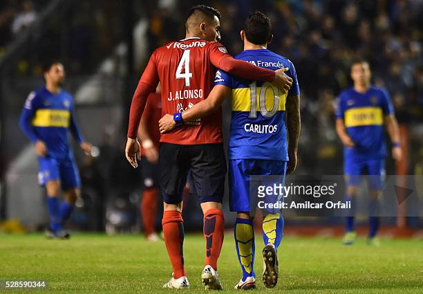 Junior Alonso of Cerro Porteno and Carlos Tevez of Boca Juniors talk during a second leg match between Boca Juniors and Cerro Porteno as part of...