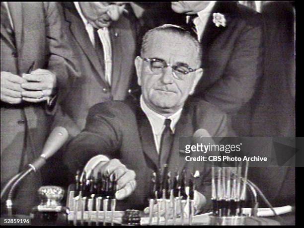 Screen capture of US president Lyndon B. Johnson as he signs the Civil Rights Act of 1964, Washington, DC, July 2, 1964.