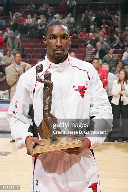 Ben Gordon of the Chicago Bulls is presented with NBA Sixth Man of the Year Award trophy prior to the start of the game against the Washington...