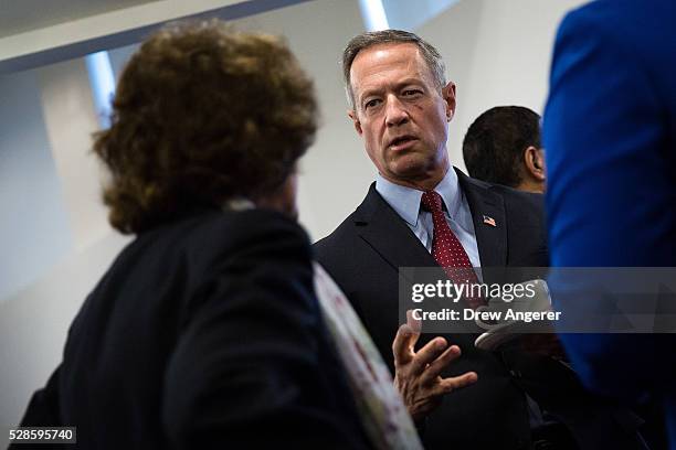 Martin O'Malley , former Maryland governor and former 2016 presidential hopeful, mingles with guests before the start of a panel discussion at the...