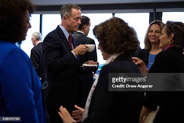Martin O'Malley , former Maryland governor and former 2016 presidential hopeful, mingles with guests before the start of a panel discussion at the...