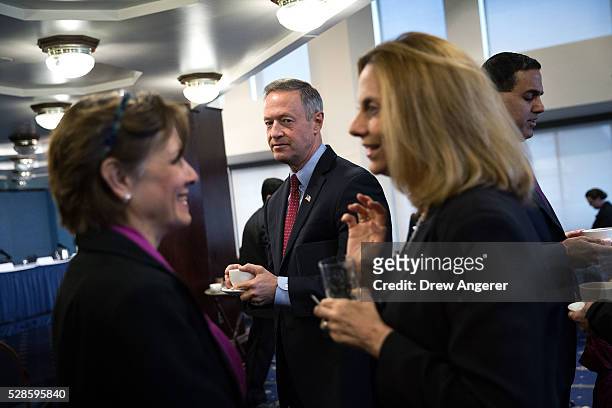 Martin O'Malley , former Maryland governor and former 2016 presidential hopeful, mingles with guests before the start of a panel discussion at the...