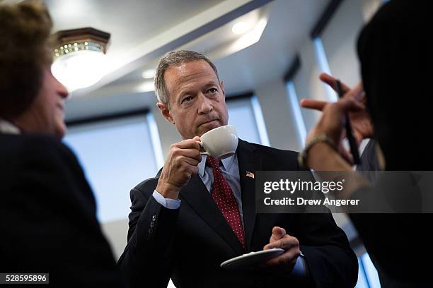 Martin O'Malley , former Maryland governor and former 2016 presidential hopeful, mingles with guests before the start of a panel discussion at the...