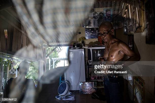 Eko Soetikno, 75 years old, stands at his house on May 04, 2016 in Kendal, Central Java. Eko, was a student, who spent 14 years imprisoned without...