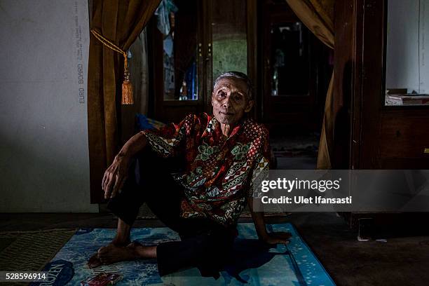 Supari, 72 years old, sits at his house on May 04, 2016 in Kendal, Central Java. Supari was spent 7 years imprisoned without trial for suspected ties...