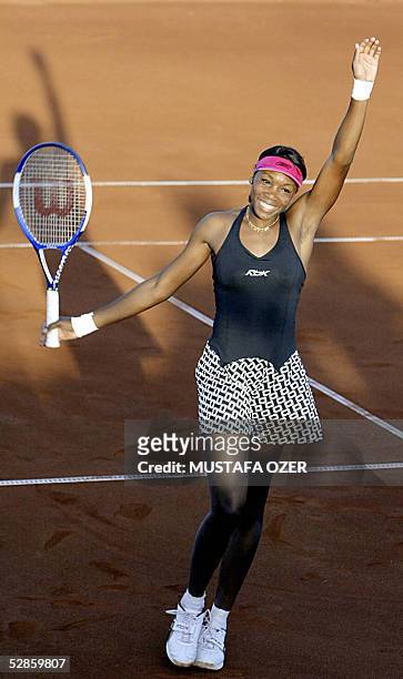 Tennis player Venus Williams celebrates after defeating Spain's Marta Marrero in their match of the WTA Tournament Istanbul Cup in Istanbul 17 May...