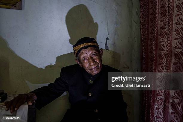 Minkarto, 75 years old, sits at his house on May 05, 2016 in Kendal, Central Java. Minkarto, was a teacher, who spent 8 years imprisoned without...