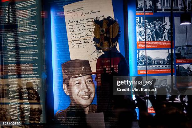 Visitor walks pass a picture of Soeharto at Soeharto museum on May 06, 2016 in Yogyakarta, Indonesia. Survivors of Indonesia's anti-communist...