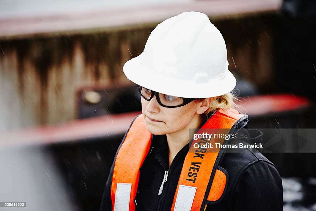 Naval architect wearing hardhat and safety glasses