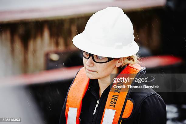 naval architect wearing hardhat and safety glasses - genderblend2015 stock pictures, royalty-free photos & images