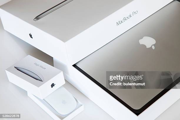 apple macbook pro. and apple magic mouse 2 - apple mac pro stock pictures, royalty-free photos & images