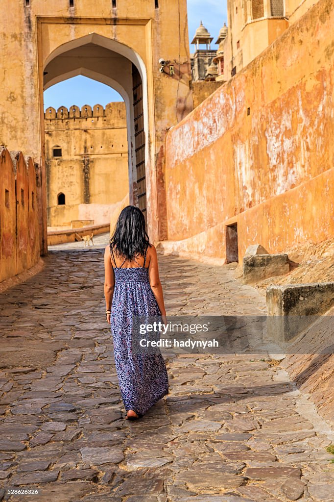 Young female tourist on the way to Amber Fort, India