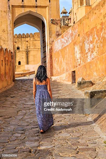 young female tourist on the way to amber fort, india - rajasthani women stock pictures, royalty-free photos & images
