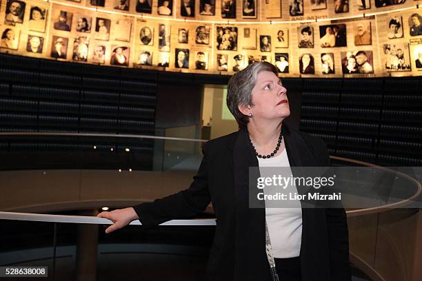 Secretary of Homeland Security, Janet Napolitano, looks at pictures of Jewish Holocaust victims at the Hall of Names during her visit to the Yad...