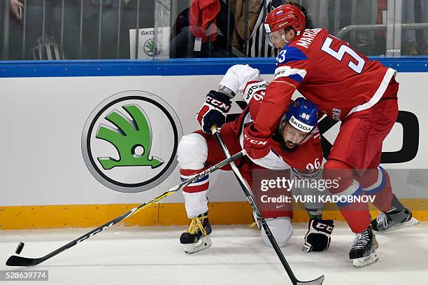 Czech forward Richard Jarusek vies with Russia's defender Alexei Marchenko during the group A preliminary round game Czech Republic vs Russia at the...