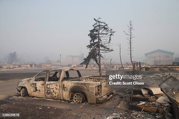 Home foundations and shells of vehicles are nearly all that remain in a residential neighborhood destroyed by a wildfire on May 6, 2016 in Fort...