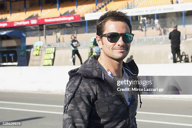 Randy De Puniet of France smiles in pit during the MotoGp of France - Free Practice on May 6, 2016 in Le Mans, France.