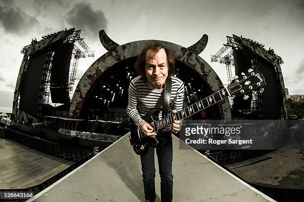 S Angus Young poses as he warms up at the soundcheck for the opening night of the Rock Or Bust Tour At the Passeio Maritimo De Alges on May 6, 2016...