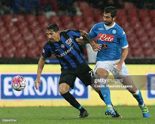 Raul Albiol of Napoli competes for the ball with Marco Borriello of Atalanta during the Serie A match between SSC Napoli and Atalanta BC at Stadio...