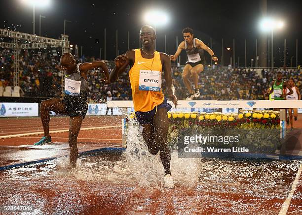 Barnabas Kipyego of Kenya clears the water jump in the Men's 3000 metres Steeplechase final during the Doha IAAF Diamond League 2016 meeting at Qatar...