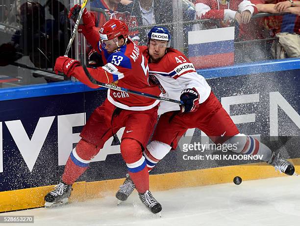 Russia's defender Alexei Marchenko vies with Czech forward Jan Kovar during the group A preliminary round game Czech Republic vs Russia at the 2016...