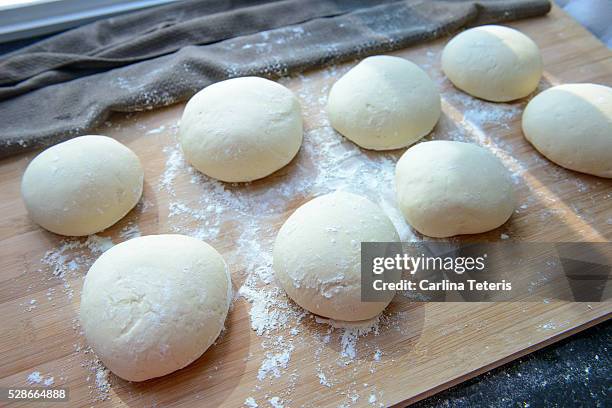 pizza dough laid out in rows to proof - future proof stock pictures, royalty-free photos & images