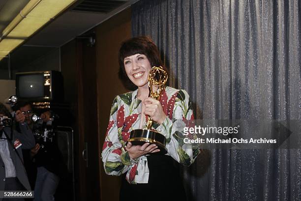 Actress, comedian, writer and producer holds up her Emmy Award for her special 'lily' at the 26th Emmy Awards held at the Pantages Theatre on May 28,...