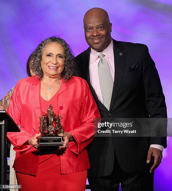 One/Radio One Chairman Cathy Hughes and President & CEO at National Museum of African American Music H. Beecher Hicks III pose with award during...