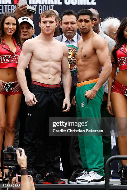 Canelo Alvarez and Amir Khan pose during their official weigh-in at T-Mobile Arena - Toshiba Plaza on May 6, 2016 in Las Vegas, Nevada. The two will...