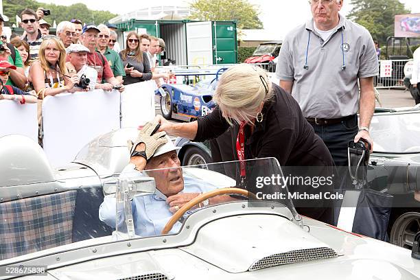 Lady Susie Moss helping Sir Stirling with his helmet strap in the1955 Mille Miglia winning Mercedes Benz 300 SLR